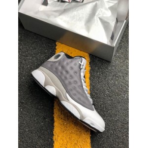 The air jordan 13 is in a new atmosphere grey color, wearing an atmospheric gray white university red and black color scheme. This air jordan 13 has a dark gray leather upper with a lighter gray on the fender and along the